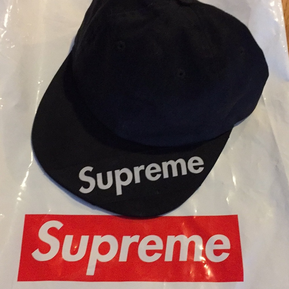 Authentic Supreme cap with leather strap.